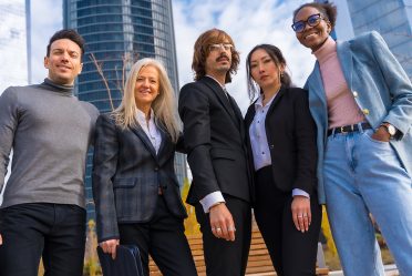 Corporate portrait of group of multi-ethnic middle-aged businessmen and businesswomen in a business park